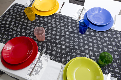 Table set with colorful plates