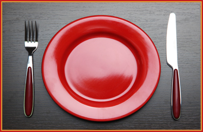 Big red plate with silverware
